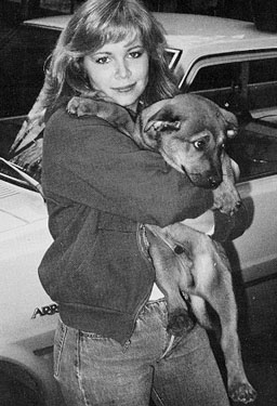 Student holding dog