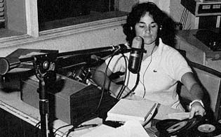 Student sat in front of radio microphone.