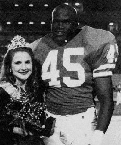 Homecoming king and queen posing for photo