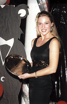 Misty holding an award