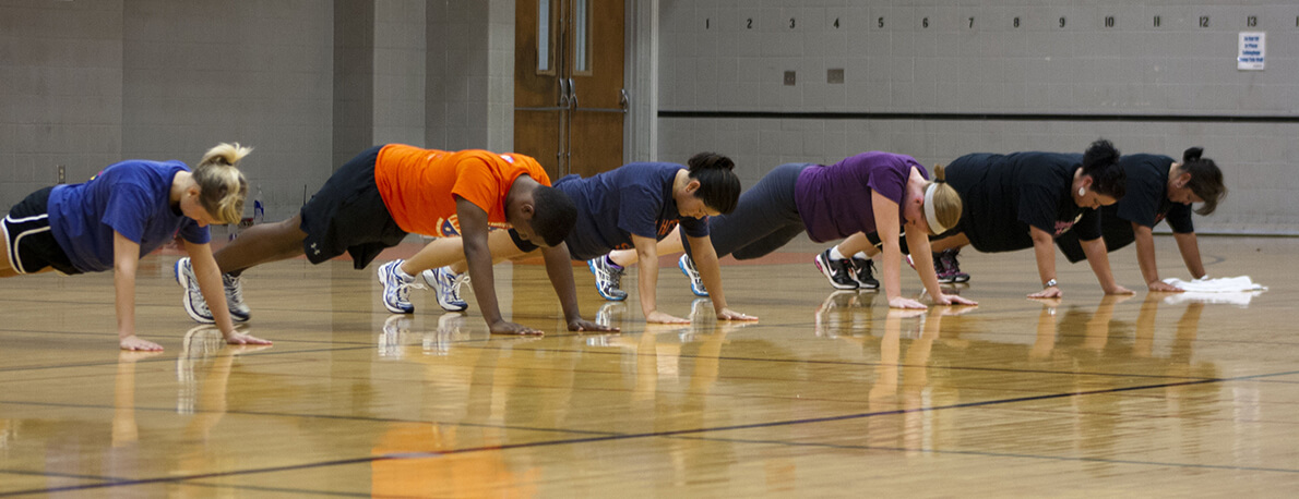fitness class in plank position