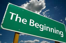 Road side that says "The Beginning"