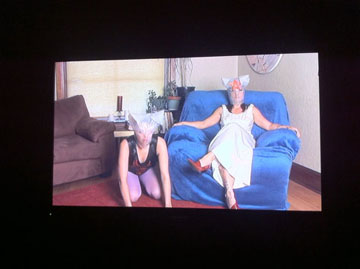 Woman with headwear in a living room.