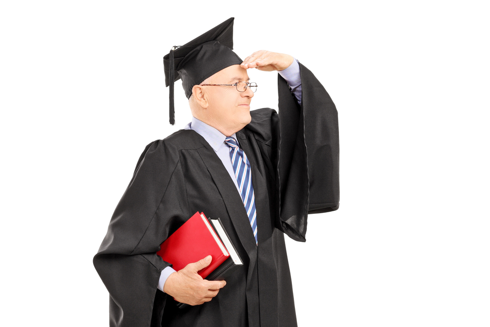 Photo of a doctoral candidate in graduation robe looking ahead