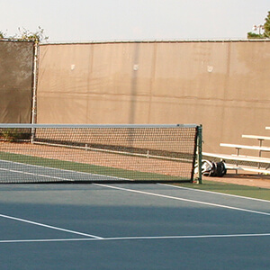 half net and bleachers of tennis court