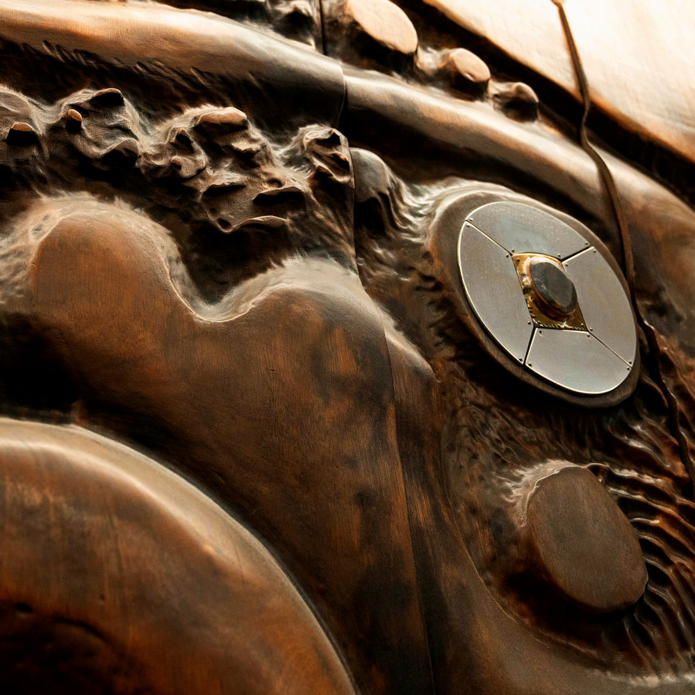 Close up image of wood and metal artwork