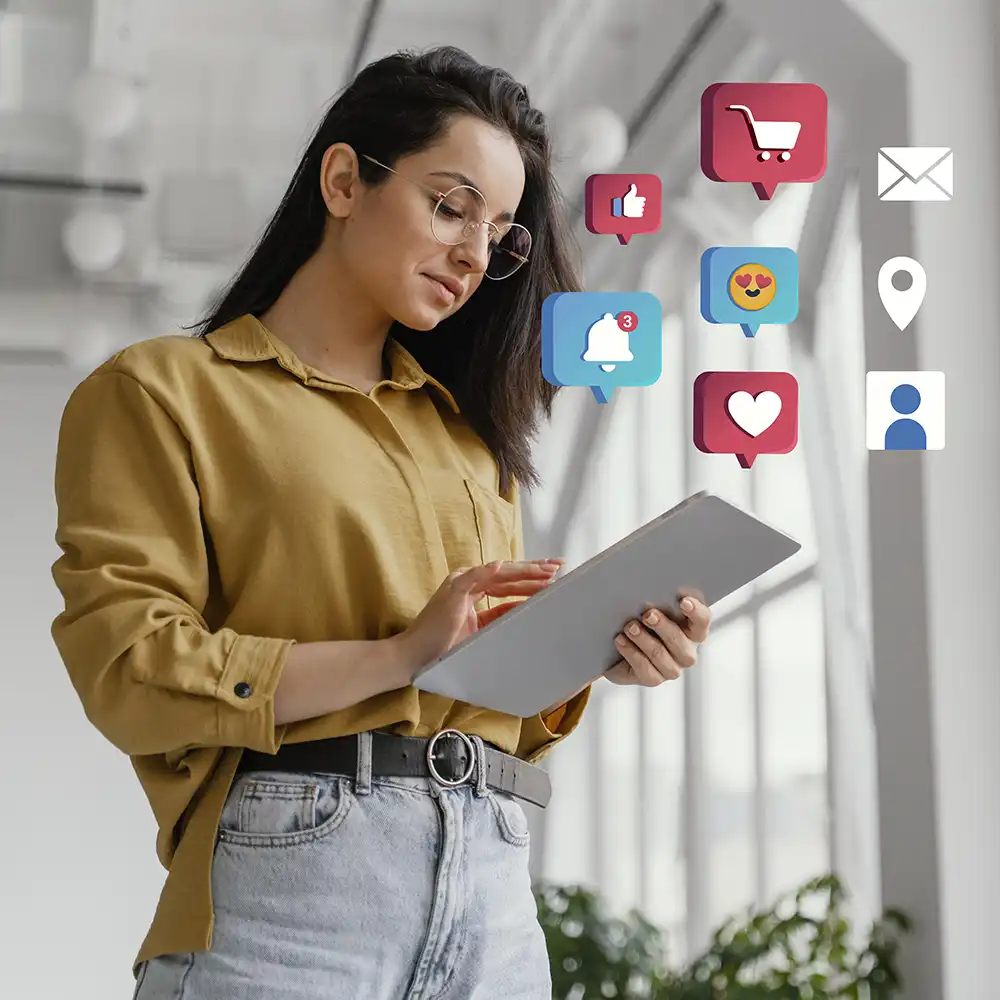 Woman using a tablet, with multiple app symbols appearing above it.