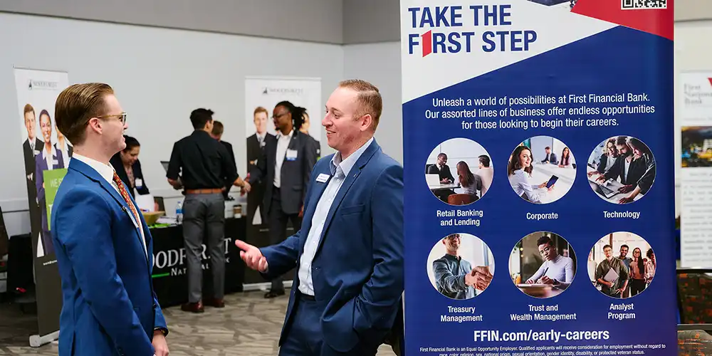 A banking student meeting with a recruiter at Banking Day.