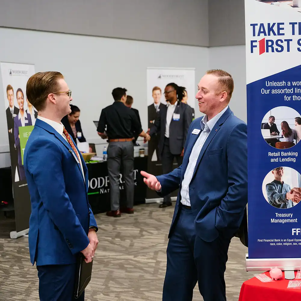 A student meeting with a recruiter at Banking Day.