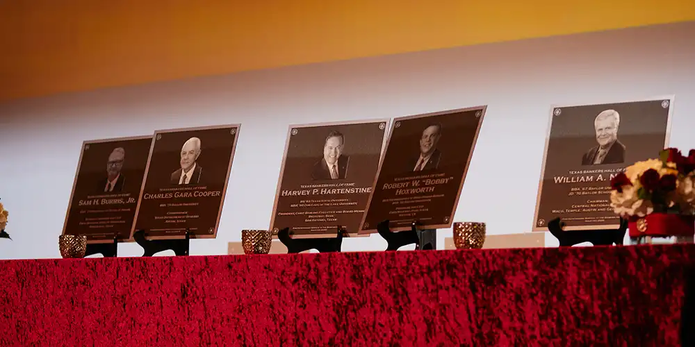 Honoree awards for the 2025 gala on a stand during the event.