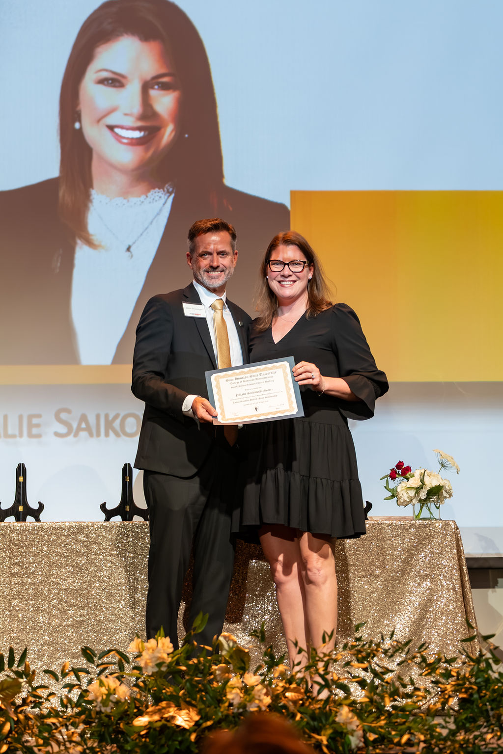 A scholarship recipient posing with the Smith-Hutson Endowed Professor of Banking.