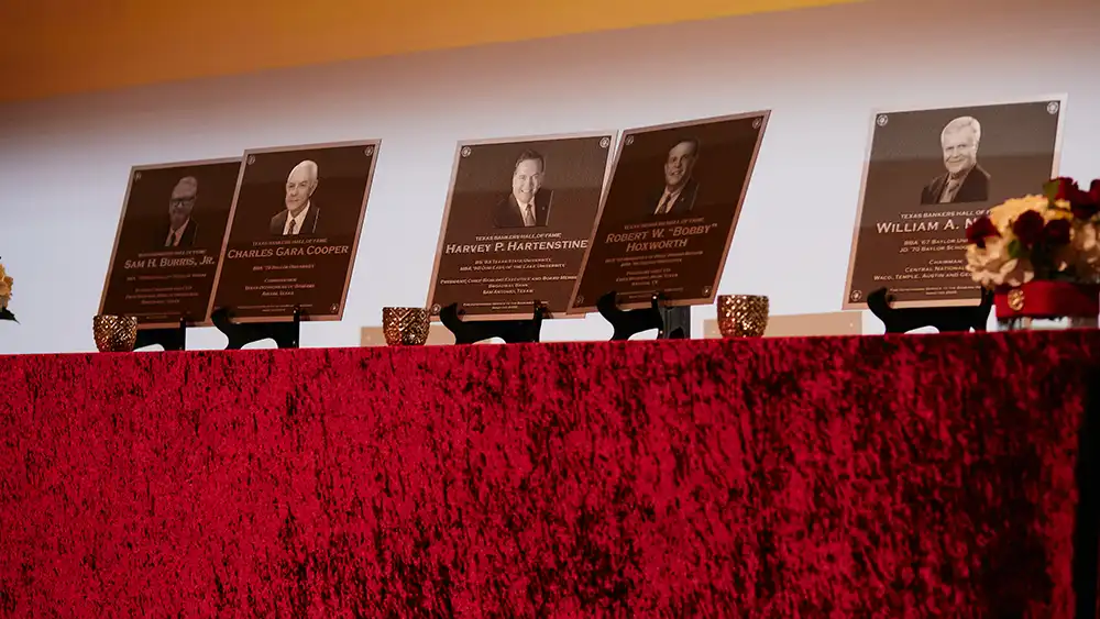 Awards for the 2025 Honorees on a stand at the gala.