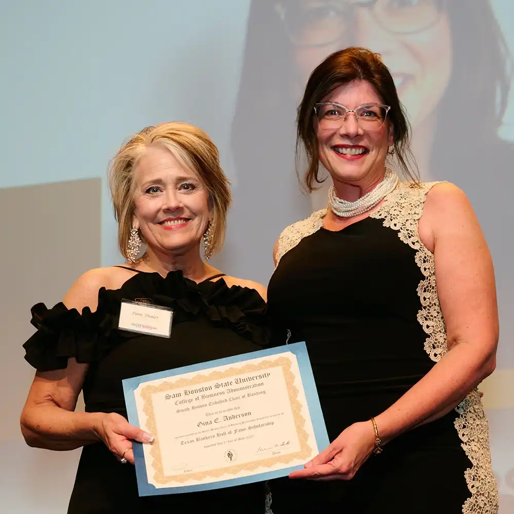 The former Associate Director of the Smith-Hutson Endowed Chair of Banking posing with a scholarship recipient.