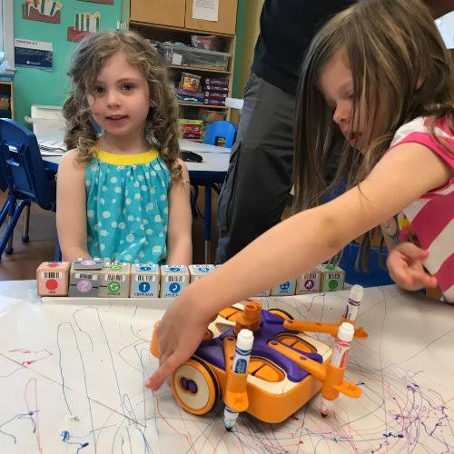 two students play with KIBO bots