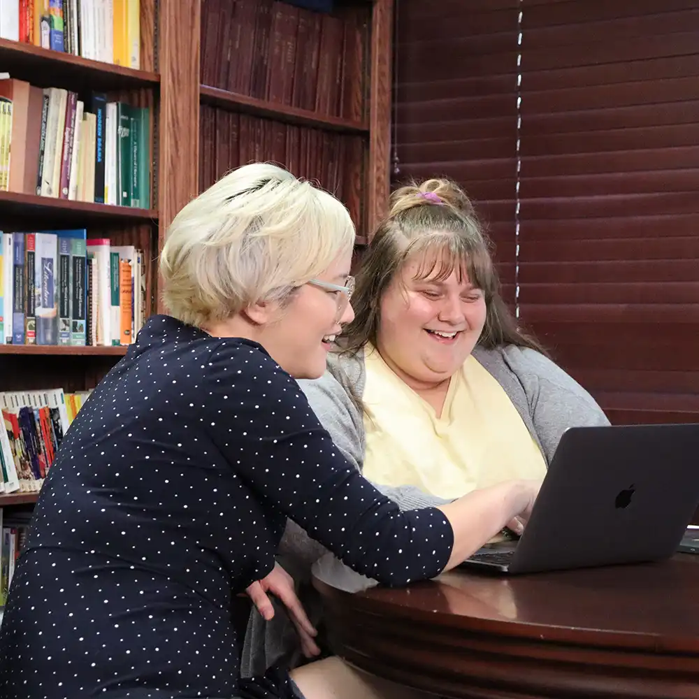 Student focused on professor during class.