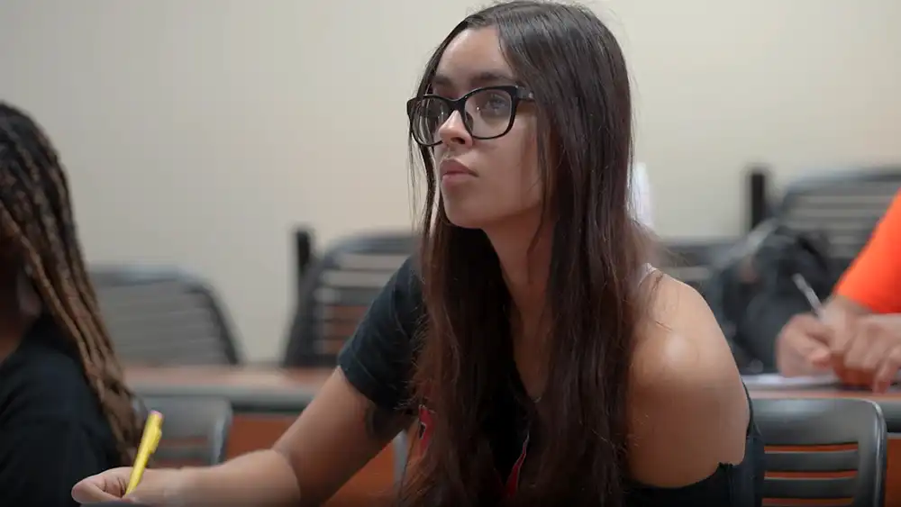 SHSU student focuses on her professor's lecture.