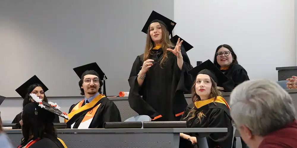 SHSU Psychology students share graduation wisdom at their hooding ceremony.