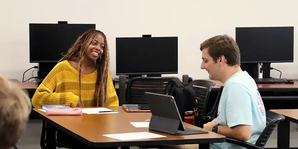 SHSU students discuss an assignment during a Sociology class.