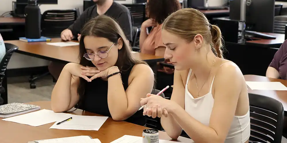 SHSU students in a Sociology class discuss the in-class project.