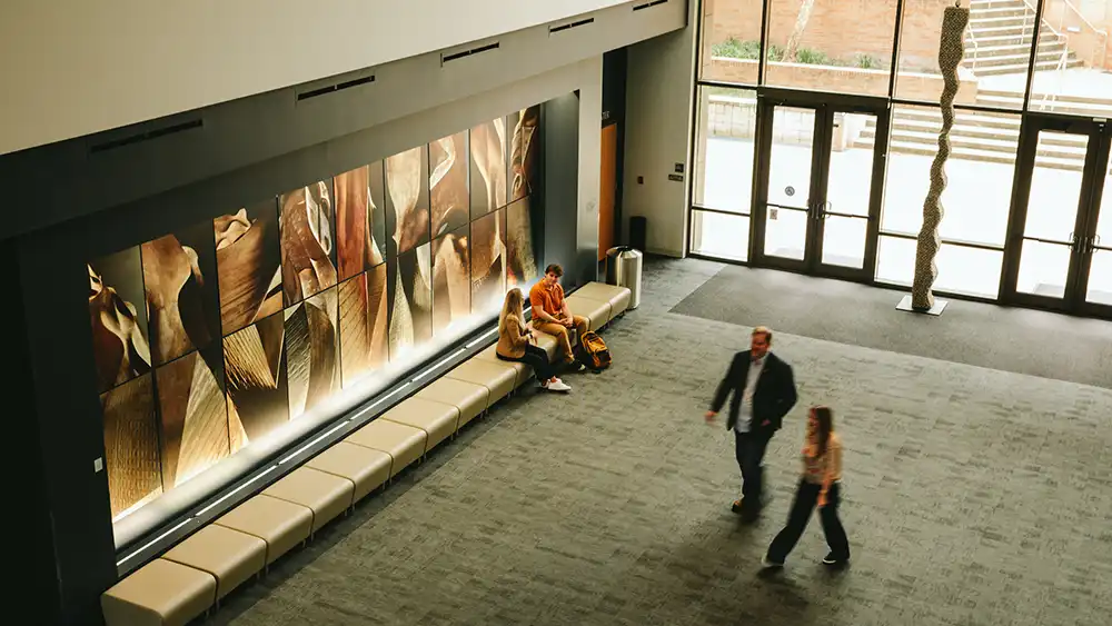 Students walking inside the art gallery.