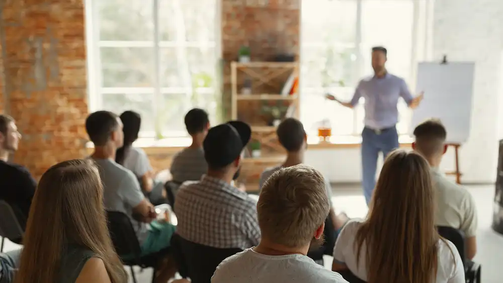 Students with a professor in a classroom