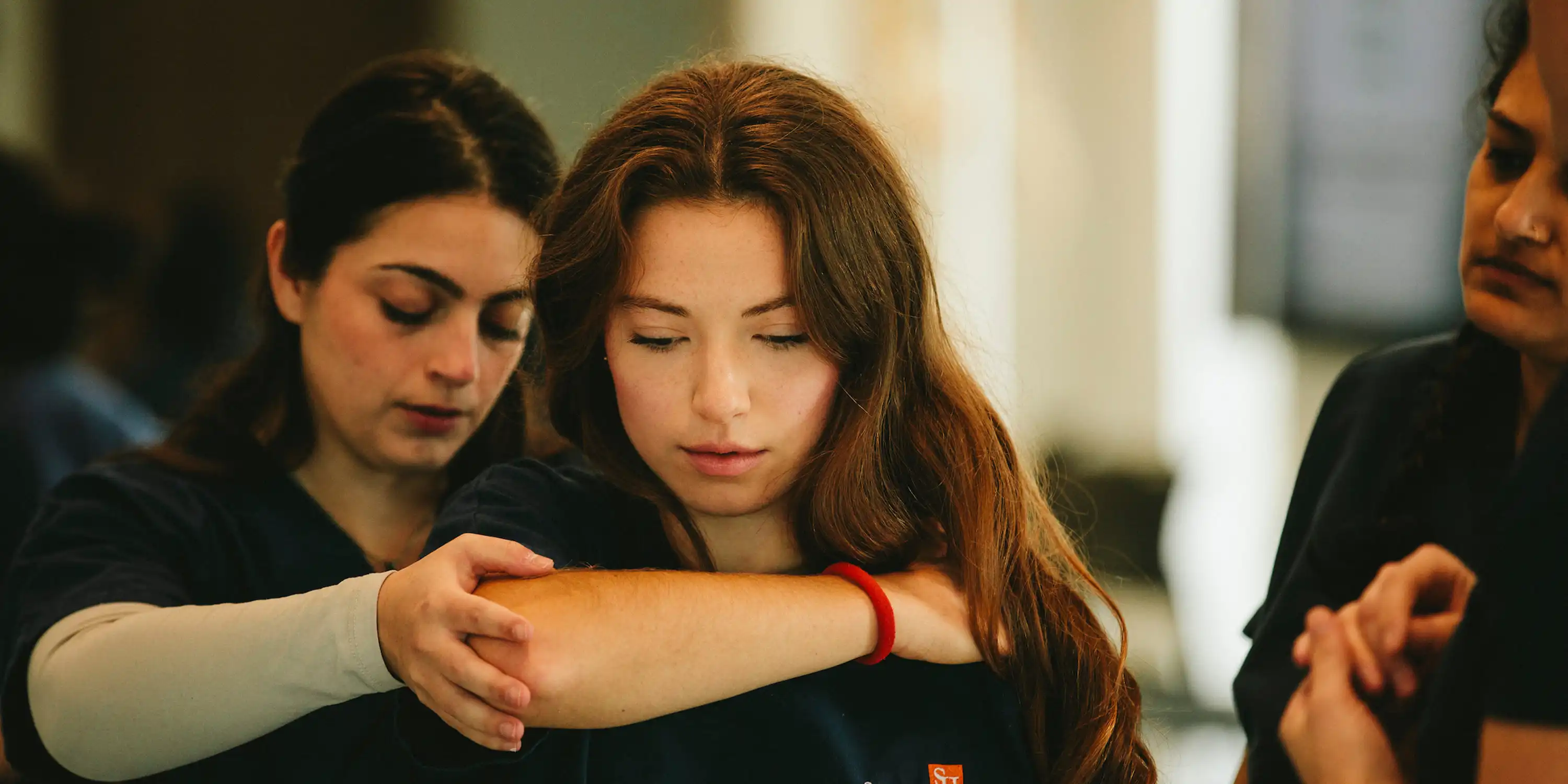 student doctors learning omm techniques