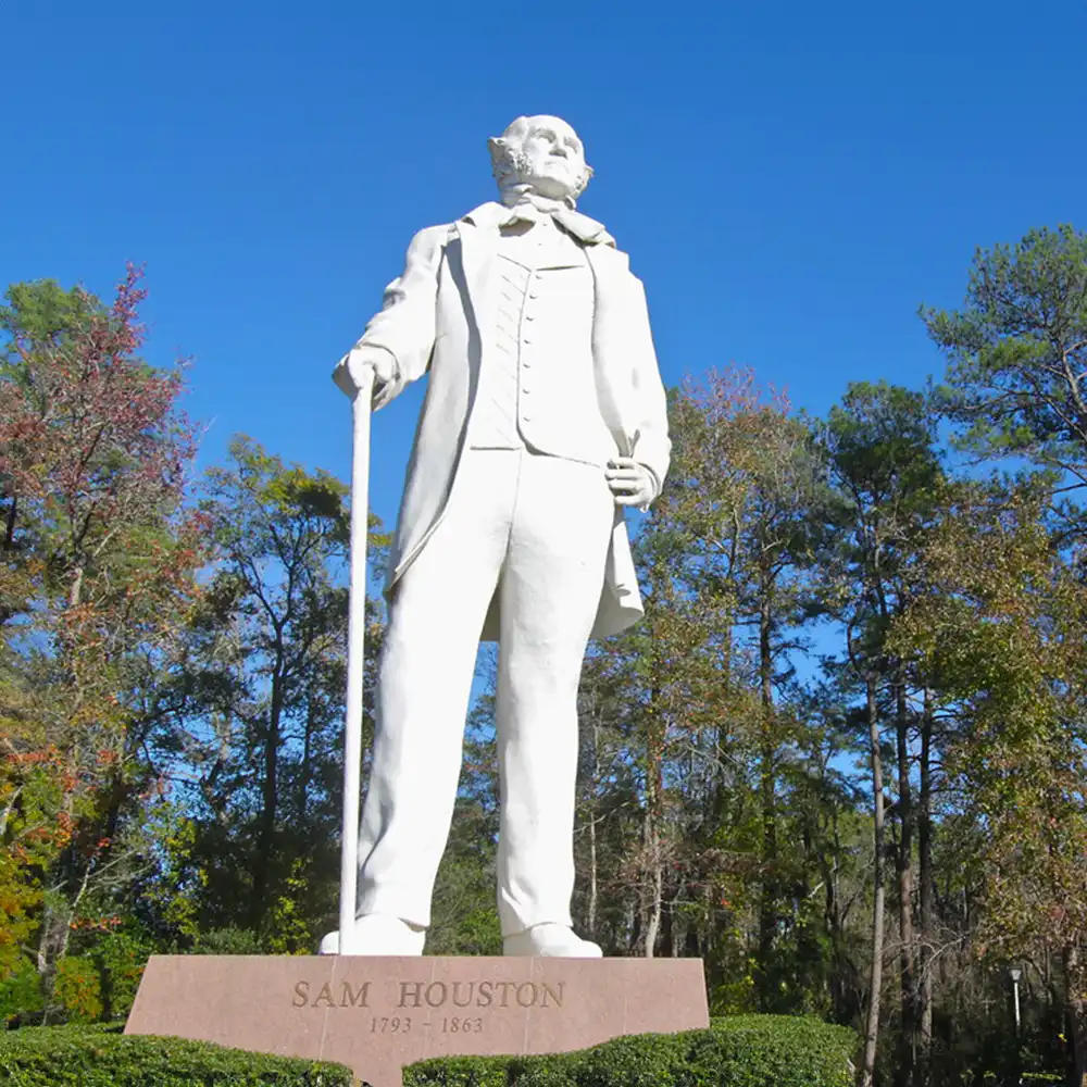 Sam Houston Statue in front of Pine Trees