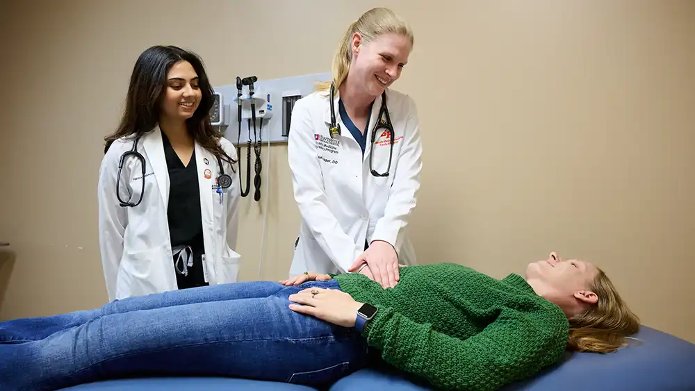 Student, preceptor and patient in a patient room