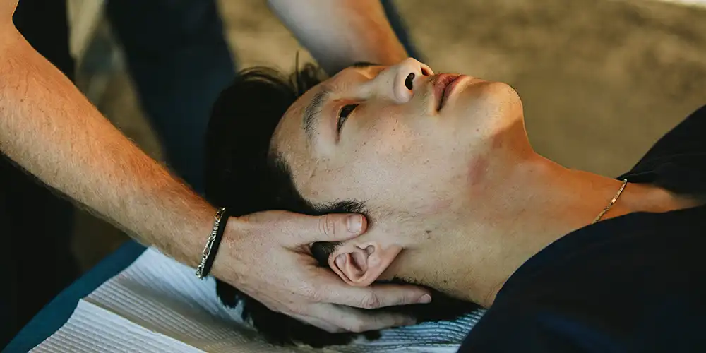 Resident with a patient doing OMT