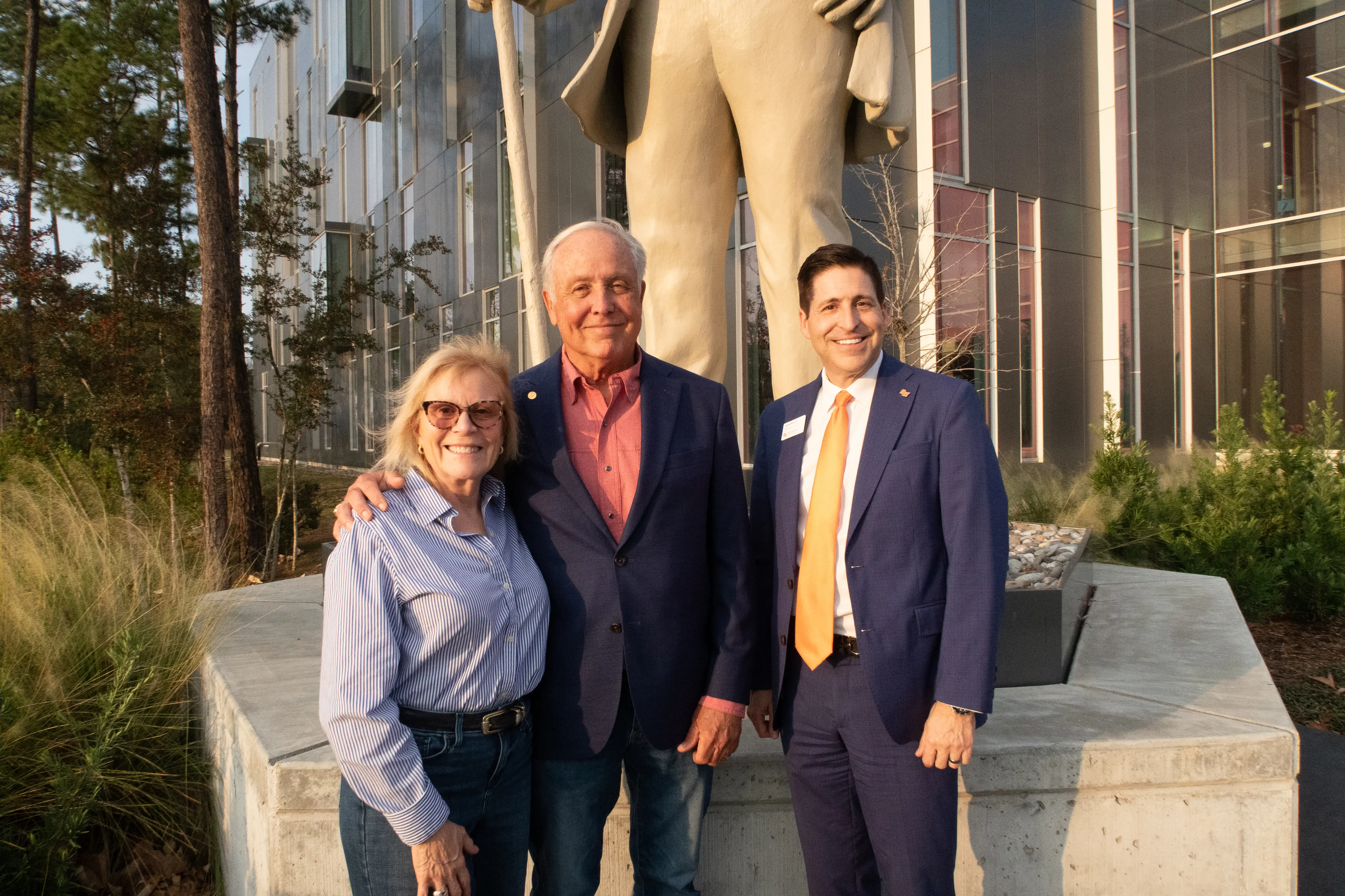 Group shot in front of SHSU-COM statue