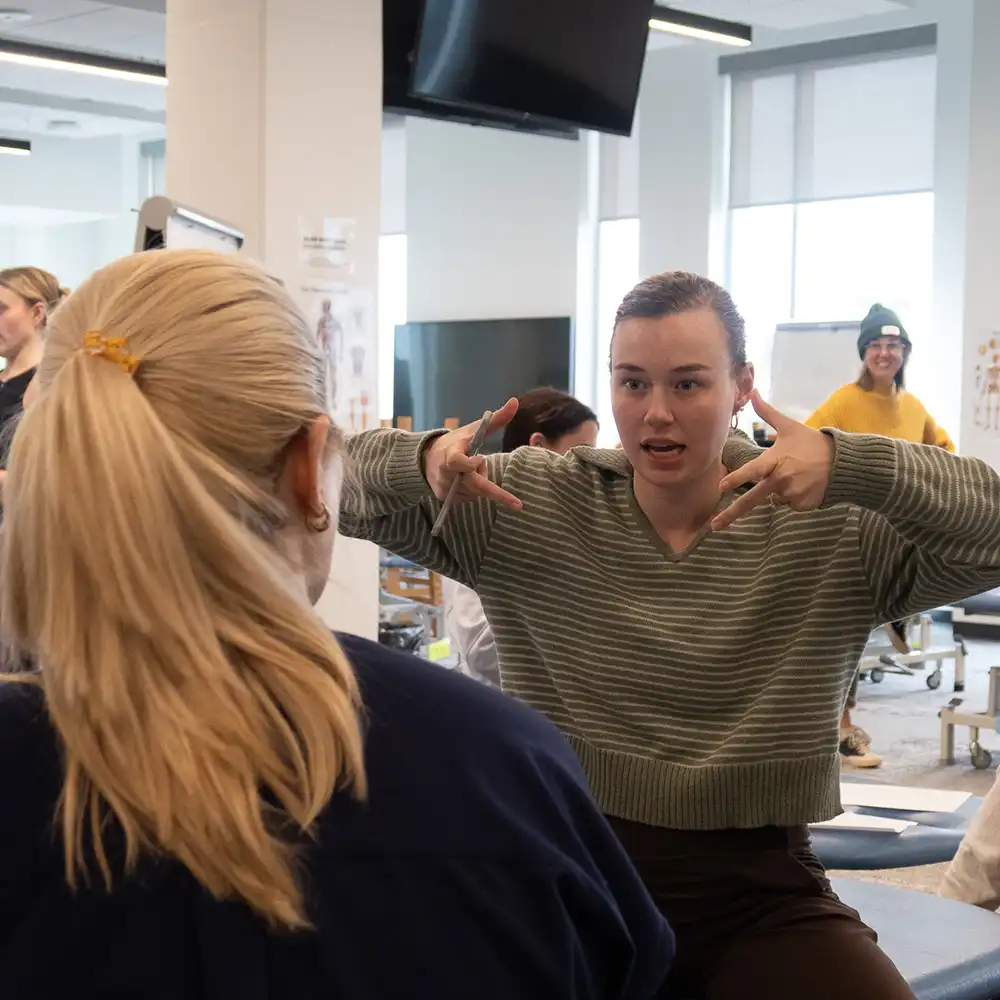 Dancer talking to student doctor
