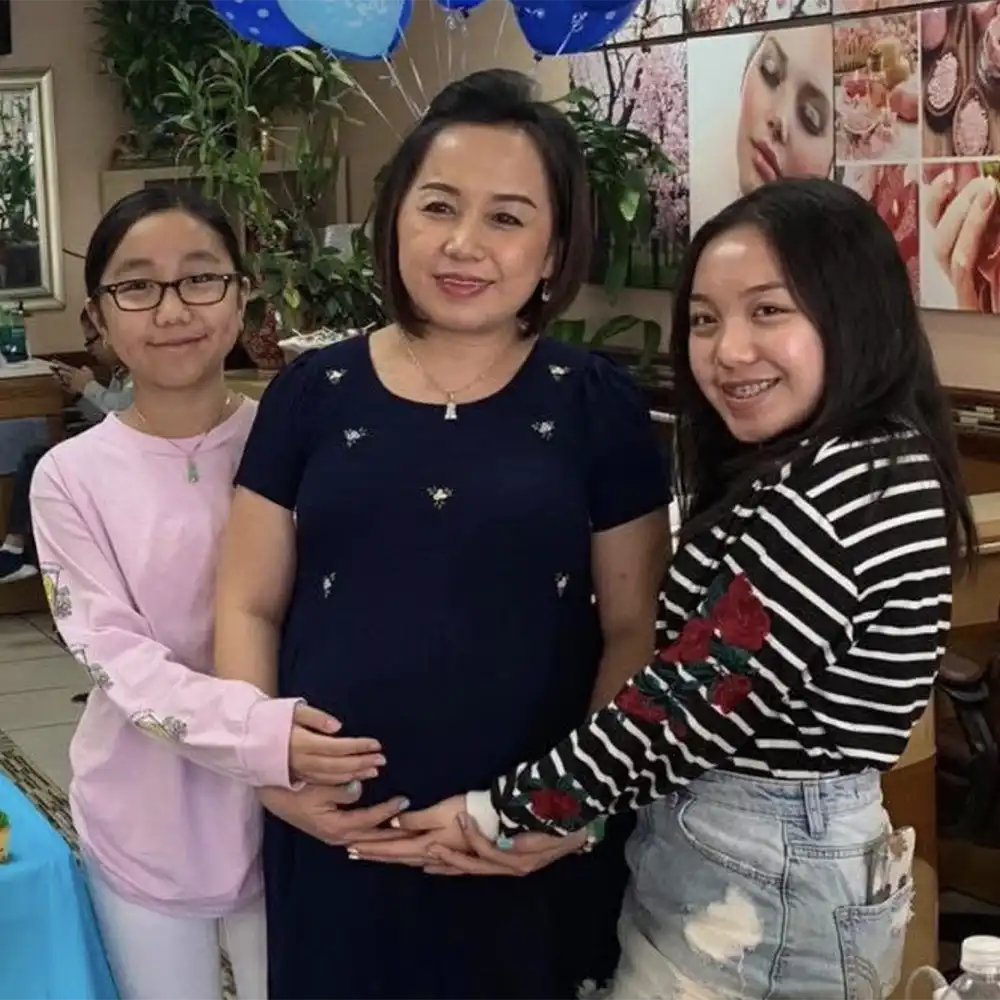 Julie and her sister with their mom at a baby shower