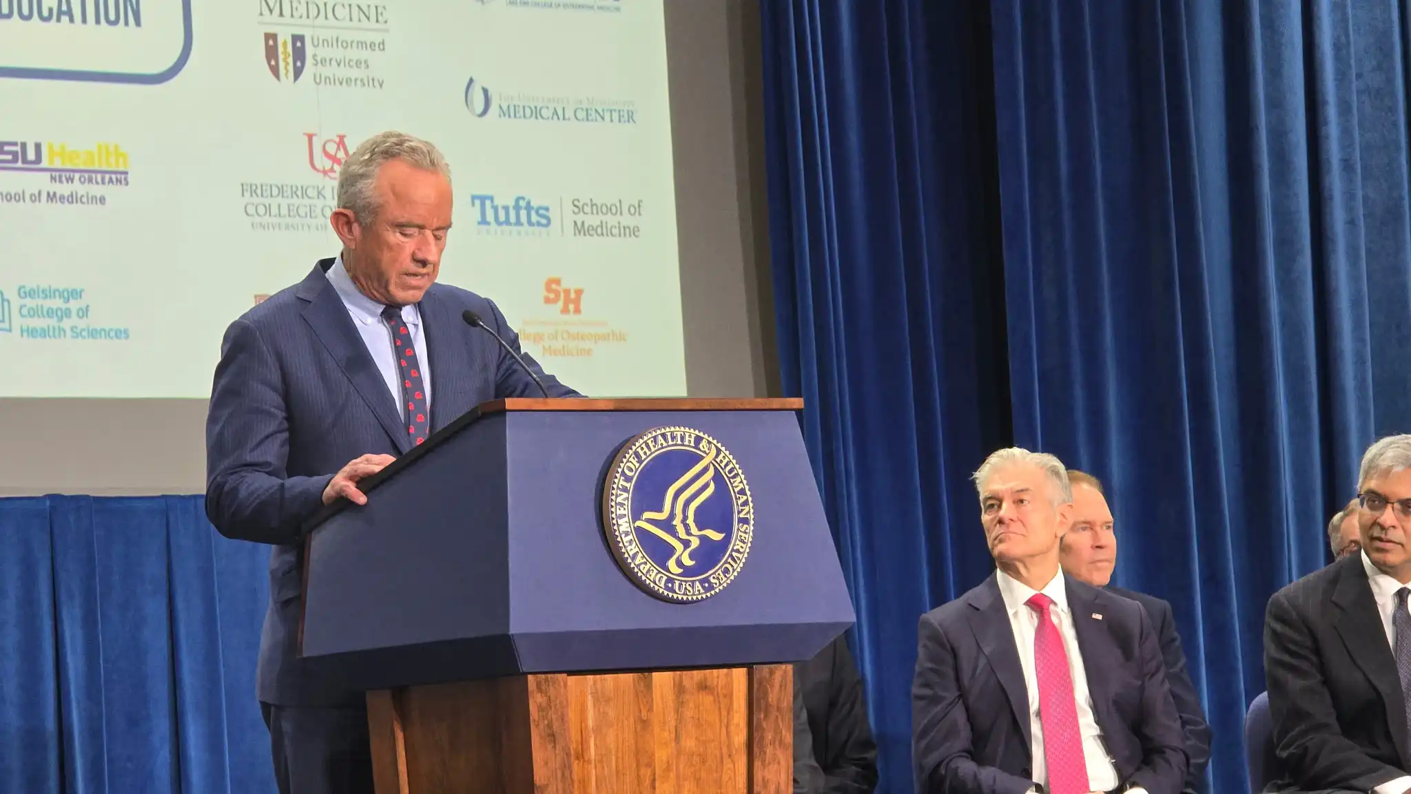 Robert F. Kennedy Jr. speaking at a podium