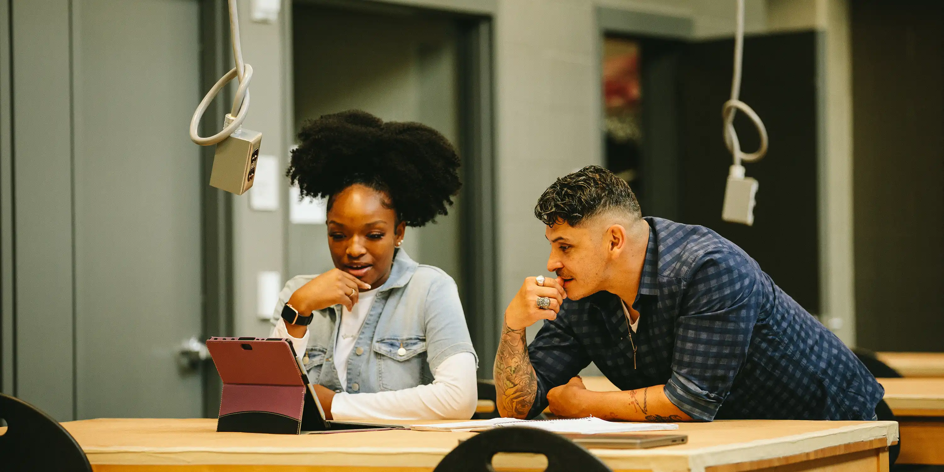 Two people in a classroom