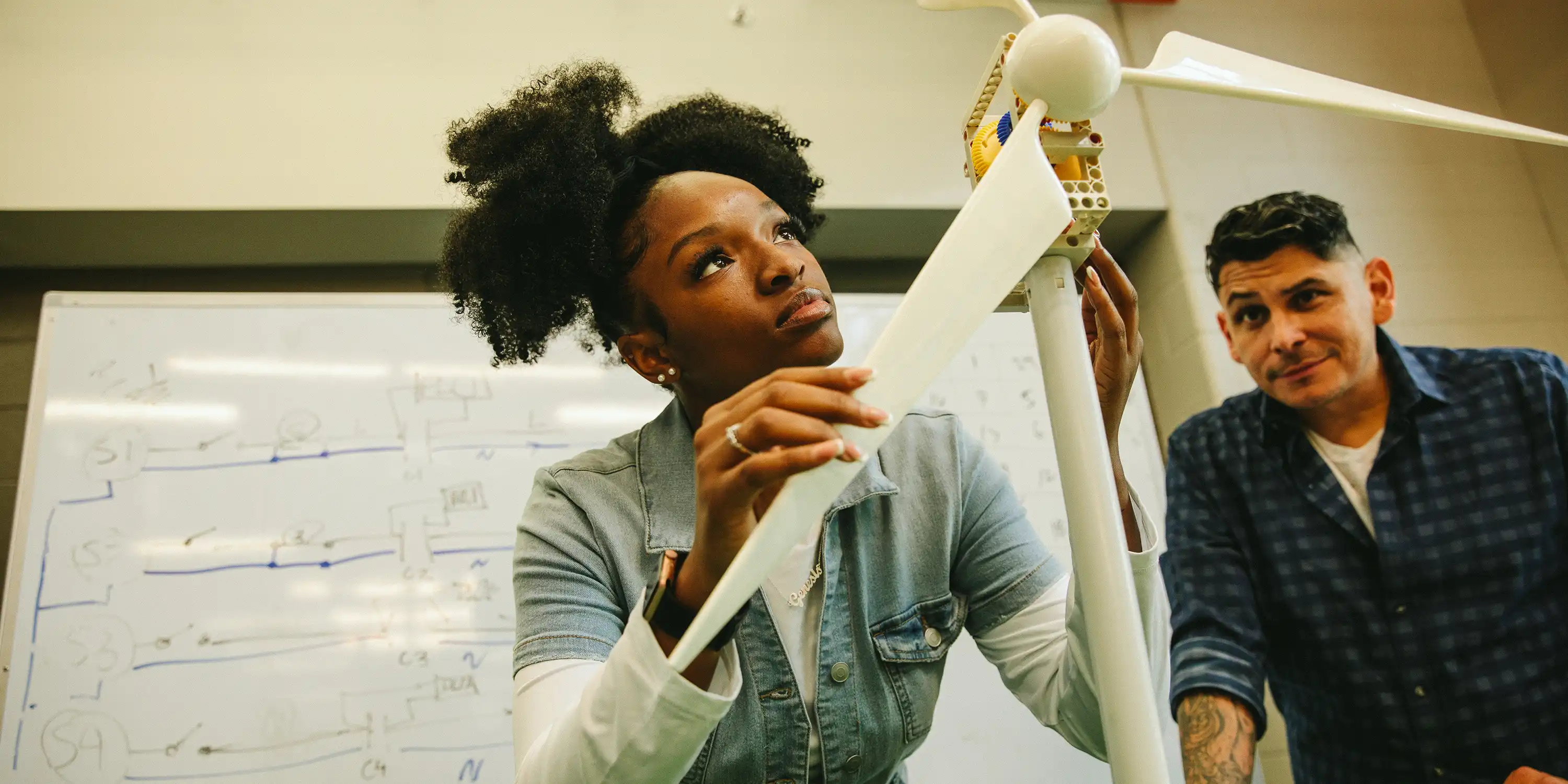 Two people in a classroom