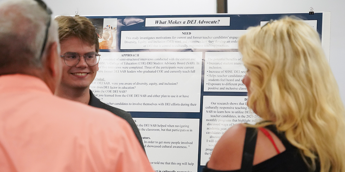 person presenting a posterboard