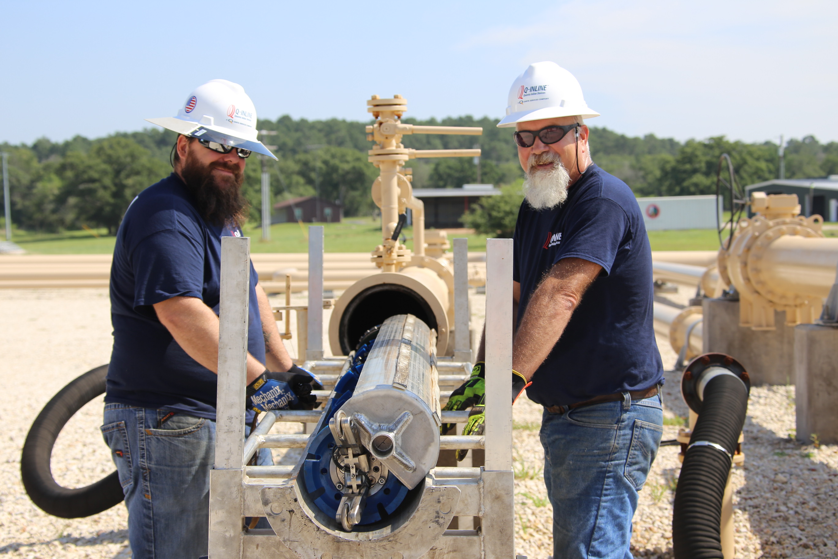 Two engineers standing with engineering equipment