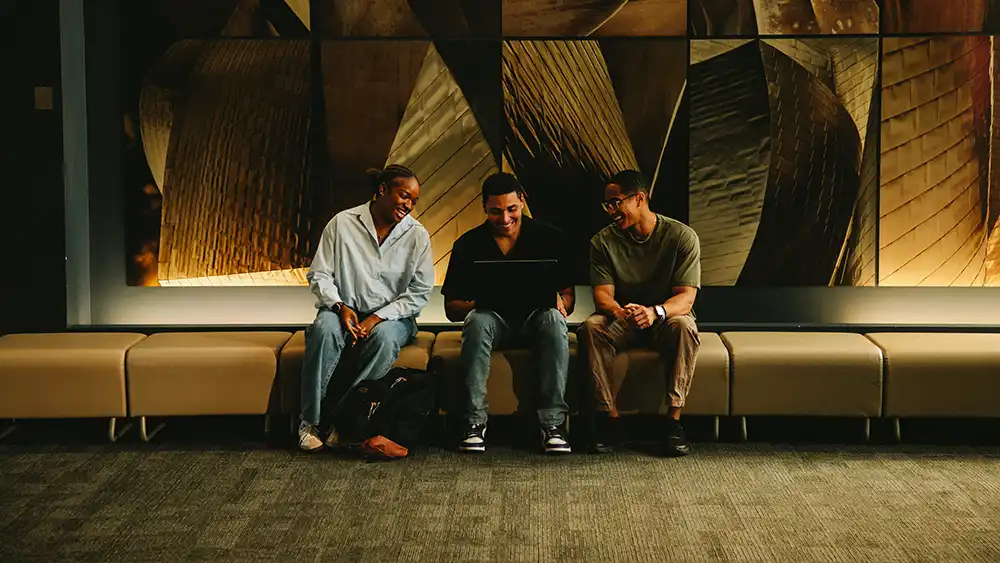 Man in suit talking to another man