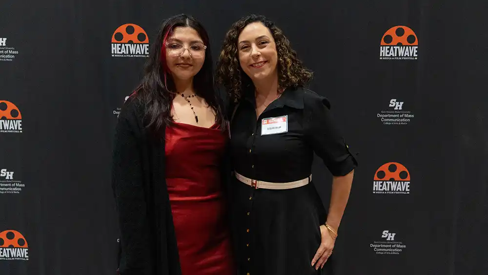 Faculty and Student at Award Ceremony