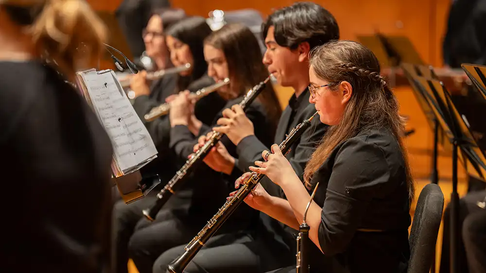 students on stage in performance
