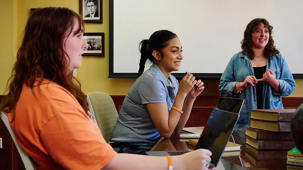 Man in suit talking to another man