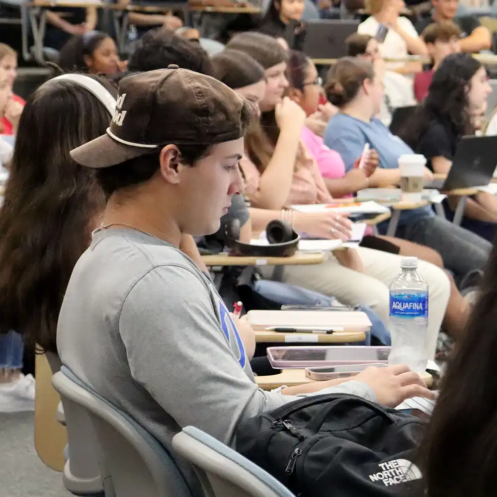 Student reviews notes during class