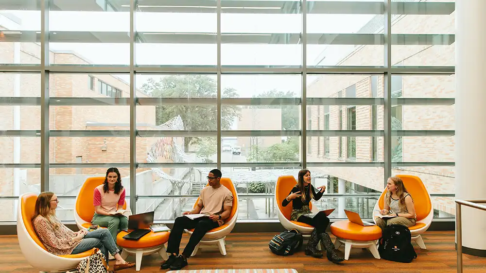 Students sitting together in the learning center.