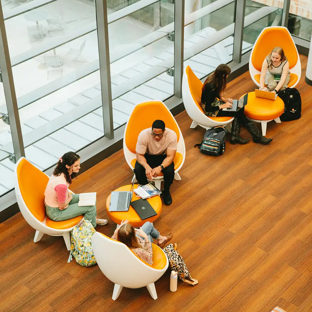 SHSU students deep in discussion in the Evan’s Complex.