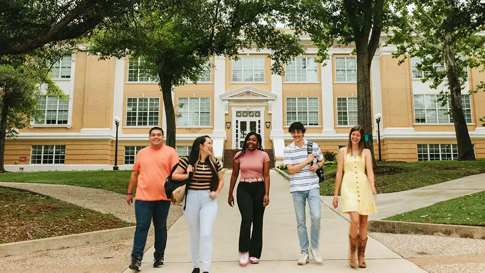 SHSU students enjoy a walk on campus.