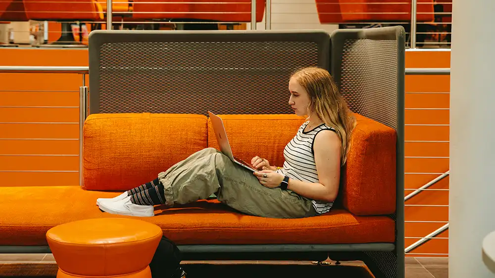 Man in suit talking to another man