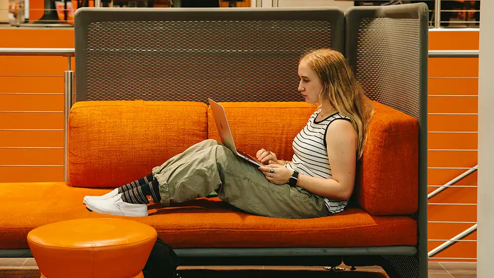 Man in suit talking to another man