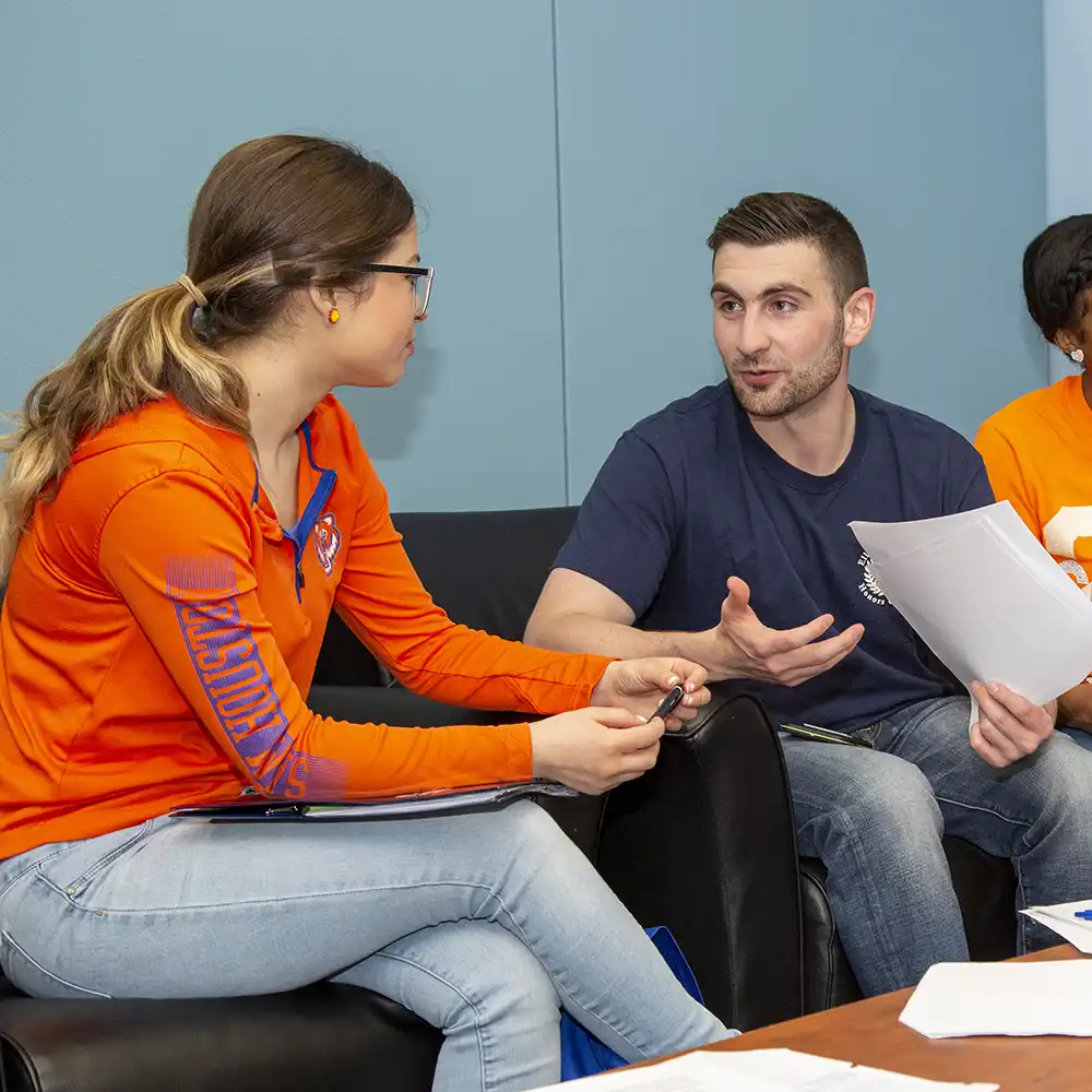 Students discuss homework assignment.