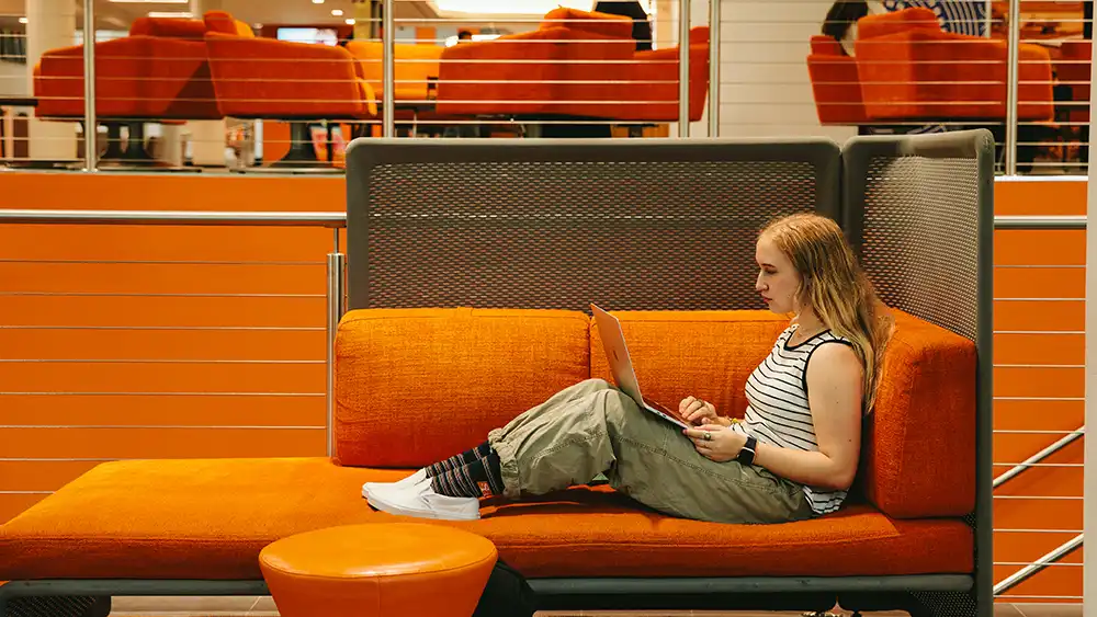 SHSU student studies in the Lowman Student Center.