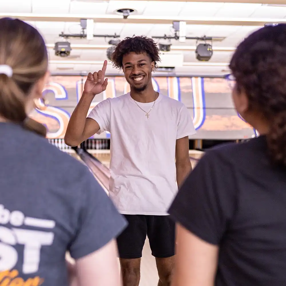 Students speaking on campus.